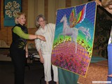 Anna Faustino showing one of her many woven creations.