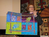Cheryl Lynch demonstrating printing on fabric.