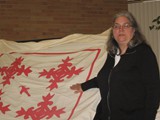 Michele McLaughlin lecturing on the history of quilting.